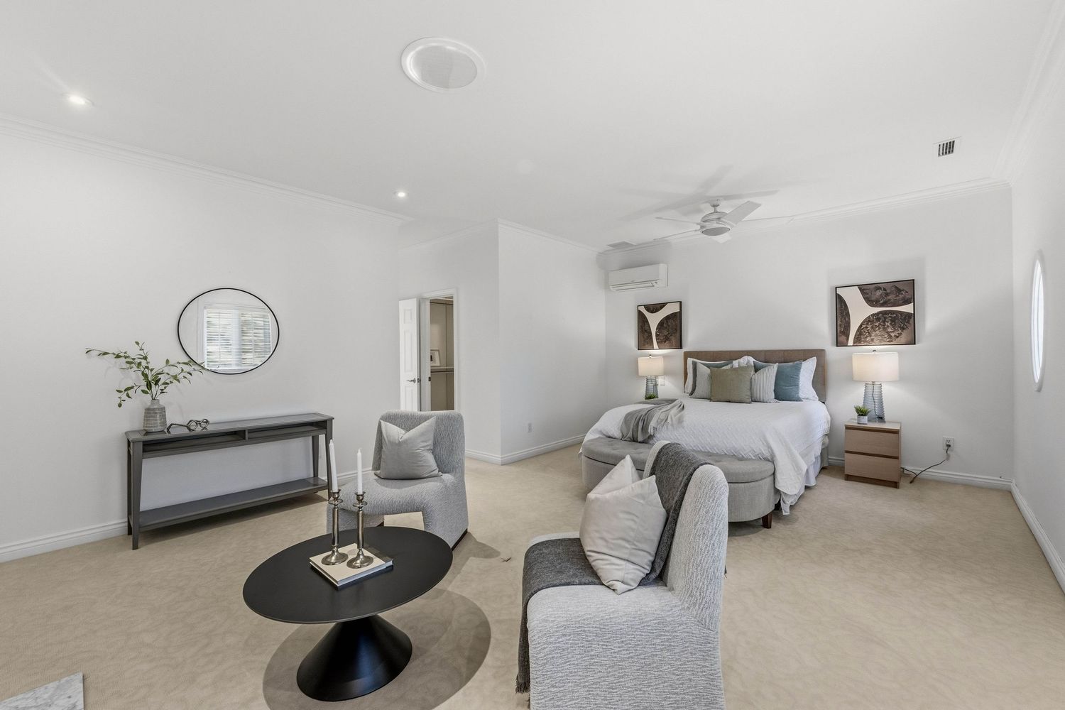 Primary bedroom suite with separate sitting area