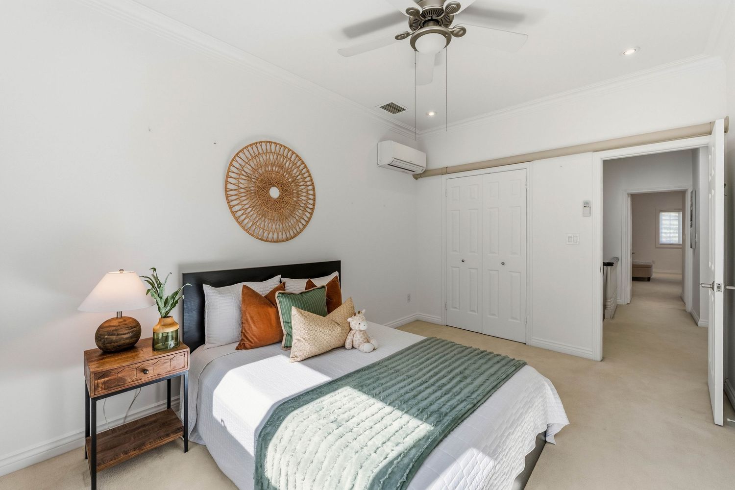 Sunlit bedroom with closet doors